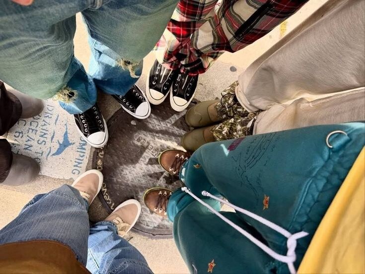 CORTIS members' shoes gathered in a circle